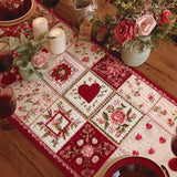 Quilted table runner with hearts and roses